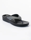 Black sandal with a checkered strap on a white background
